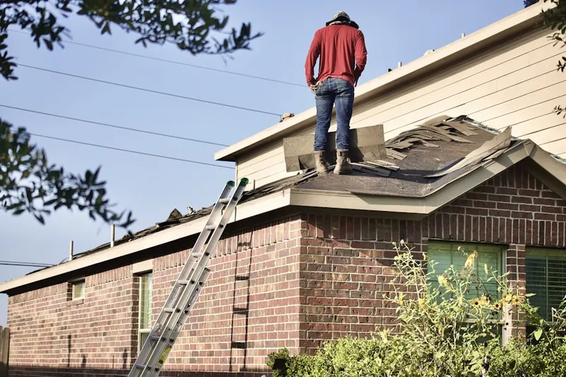 Professional roofer working on a residential roof in Palm Springs North